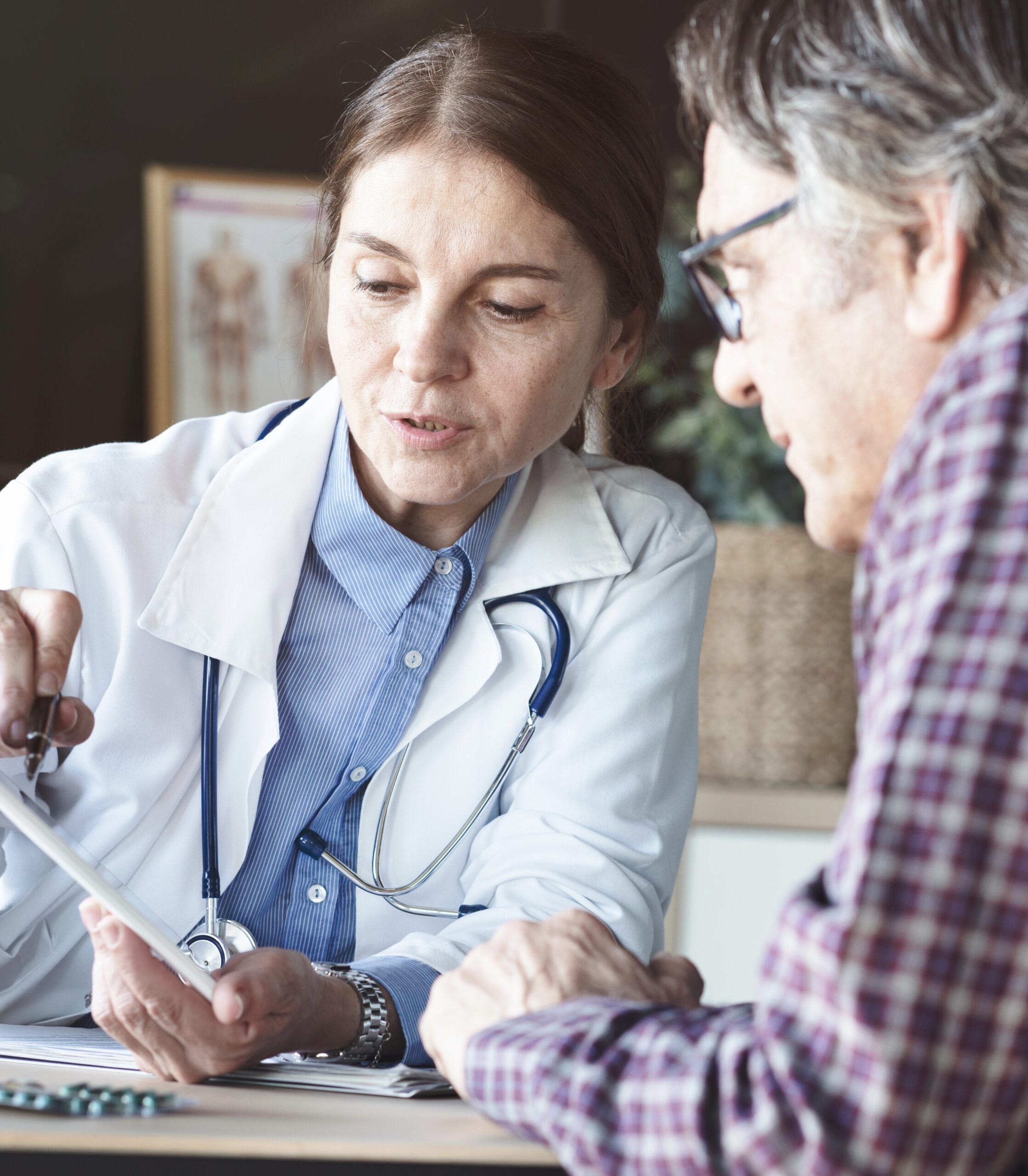 Doctor with patient in medical office